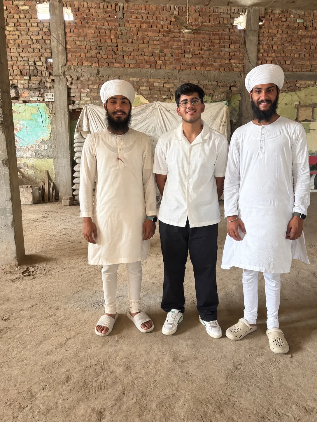 Aarush Singh Minhas with musicians and volunteers during a workshop in Attari